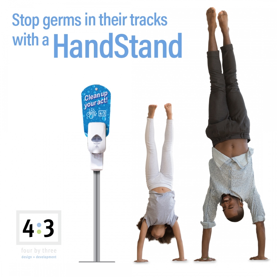 father and daughter doing a hand stand next to a HandStand dispenser